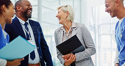 Buy stock photo Doctors, laughing and group in hallway at hospital for breakthrough, progress and comic story at meeting. Clinic director, men and women with diversity, teamwork and funny joke for health services