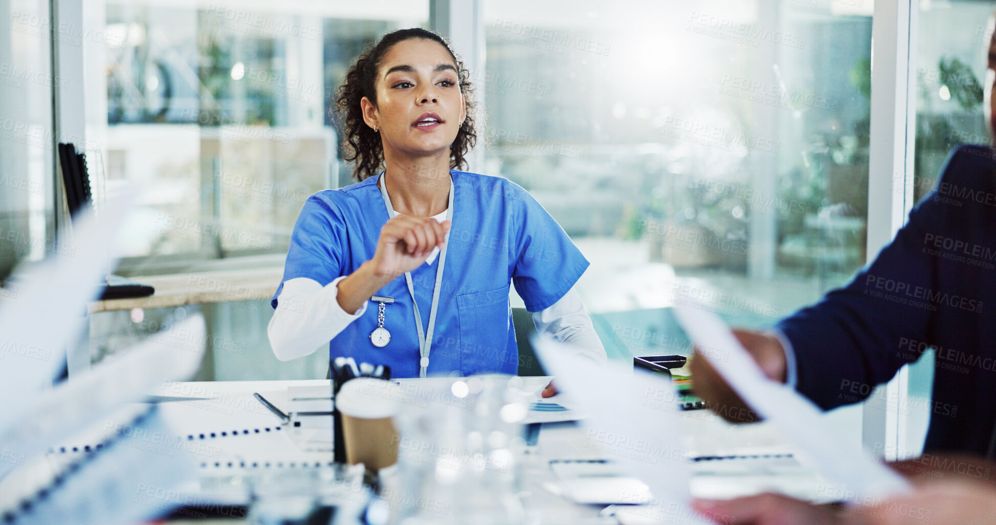 Buy stock photo Doctors, nurses and paperwork in meeting for hospital management, funding or planning in busy office. Teamwork, strategy and group of people in conference room for medical collaboration in healthcare