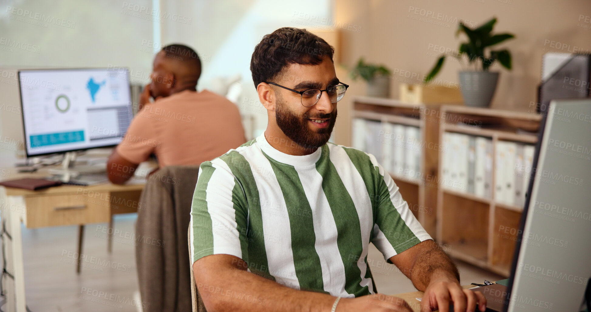 Buy stock photo Creative, business and man on computer in startup office for research, solution and brand promotion. Smile, online and worker reading email for target demographic, geo marketing and data for ads