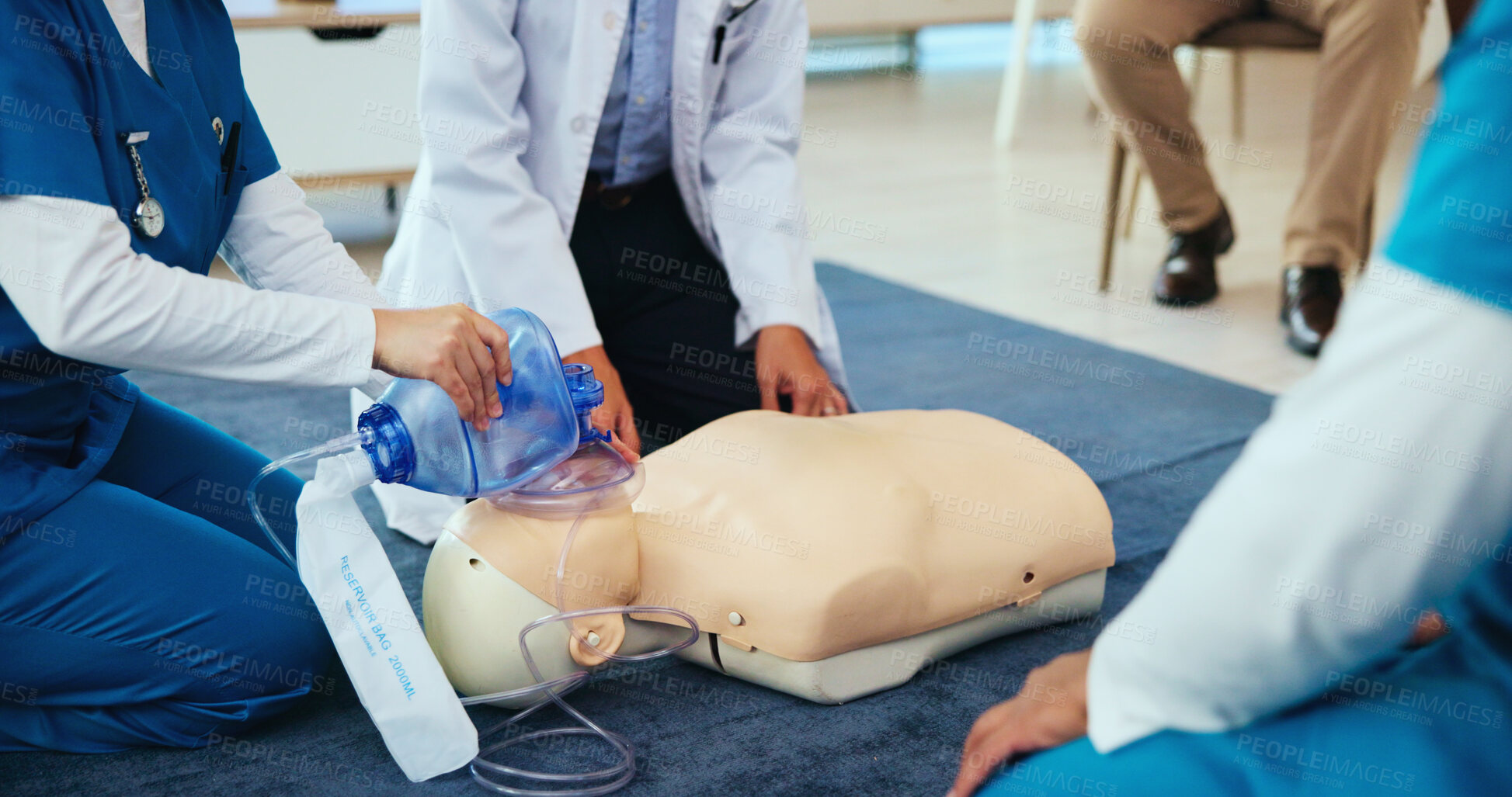 Buy stock photo Mask, hands or students with doctor for cpr on mannequin for first aid, learning or healthcare protocol. Medical class, nurses or people with breathe or respiratory tool in paramedic or nursing study