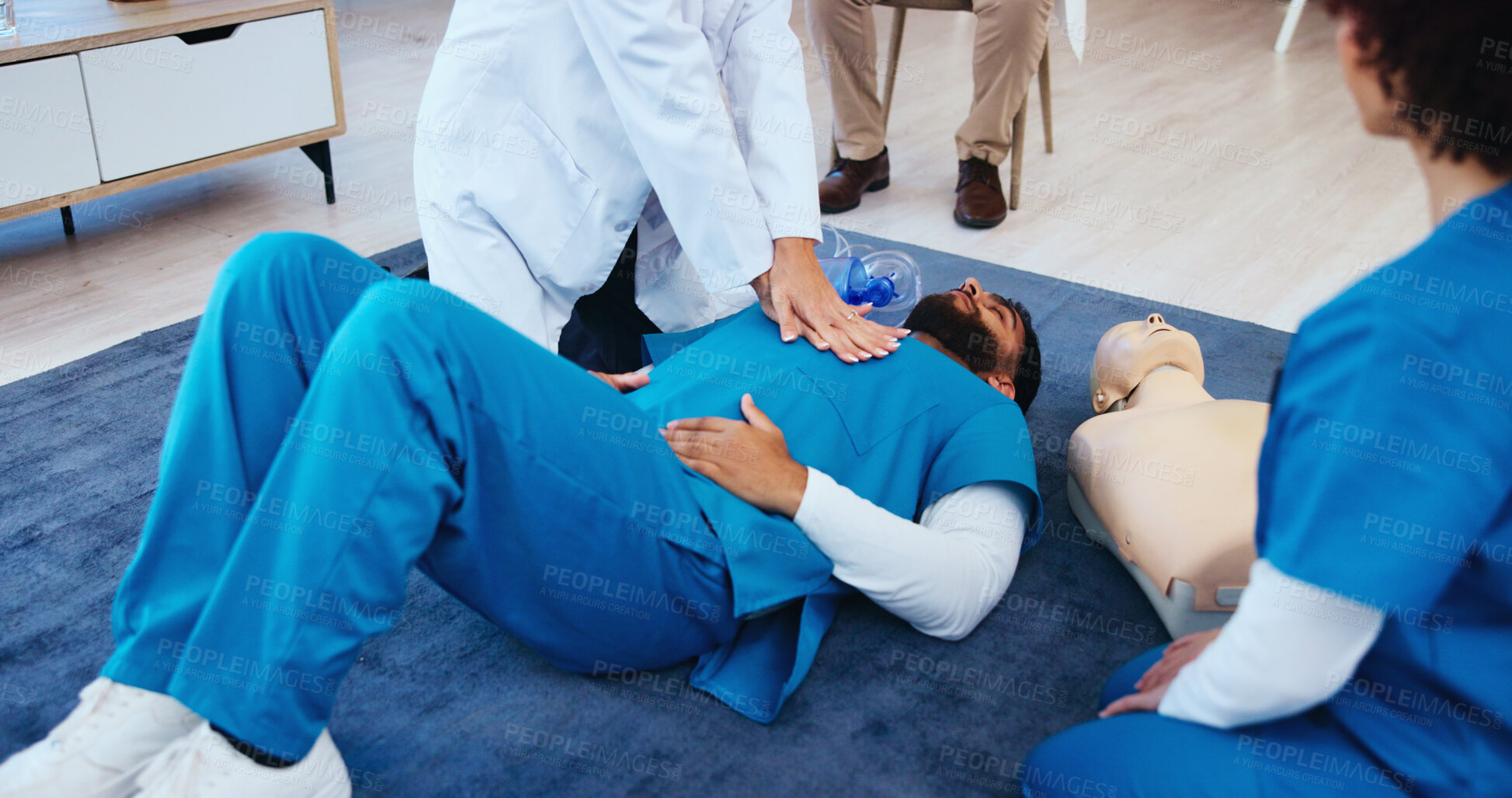 Buy stock photo Chest, hands or doctor teaching cpr on person for first aid help, cardiac arrest or healthcare protocol. Medical class, students or people with respiratory tool in paramedic course or nursing school