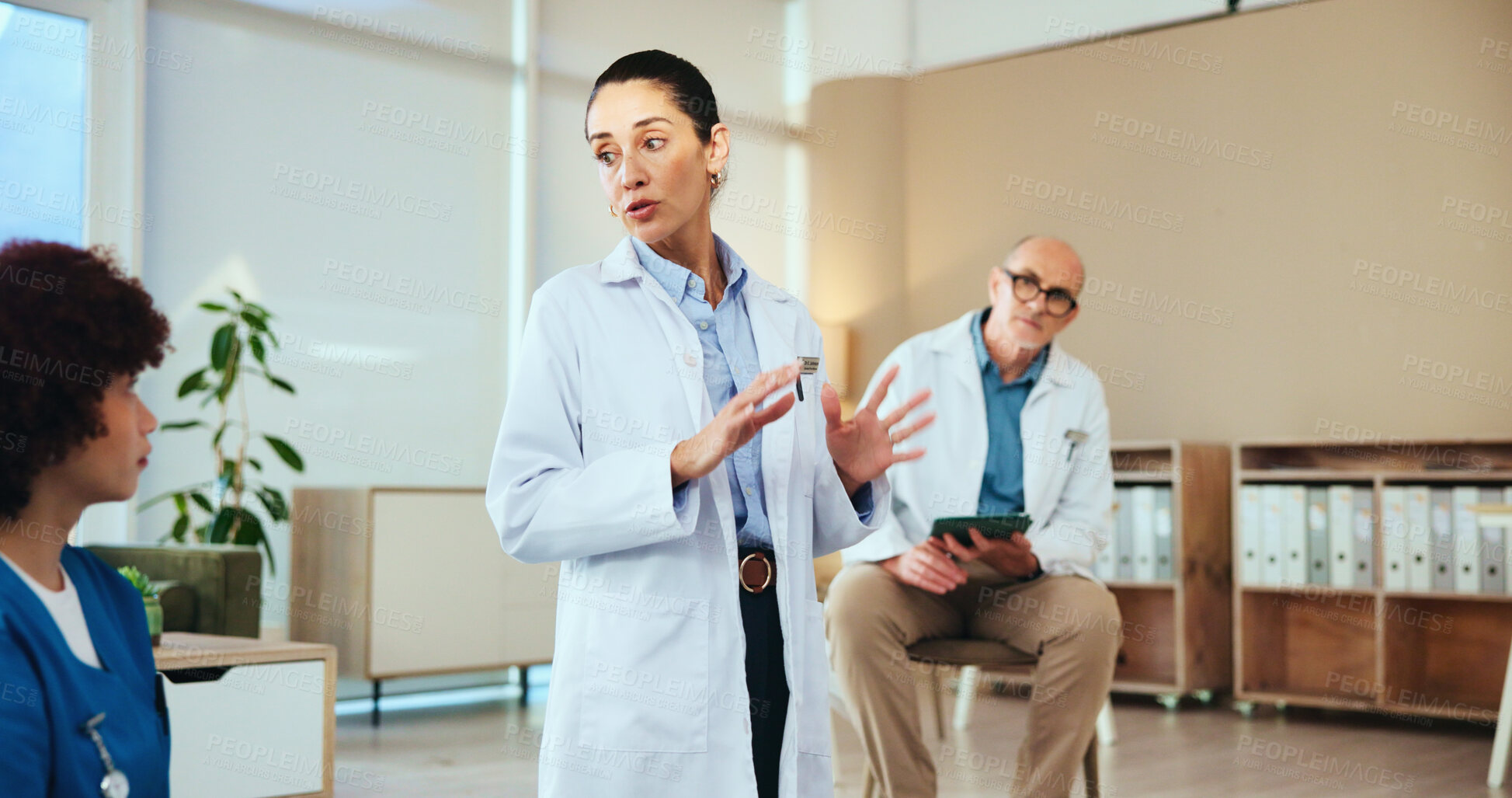 Buy stock photo Healthcare, nurse and doctors with discussion for training, medical education or skills development. Team, intern and mentor with teaching for diagnosis, workshop or director with tablet for research