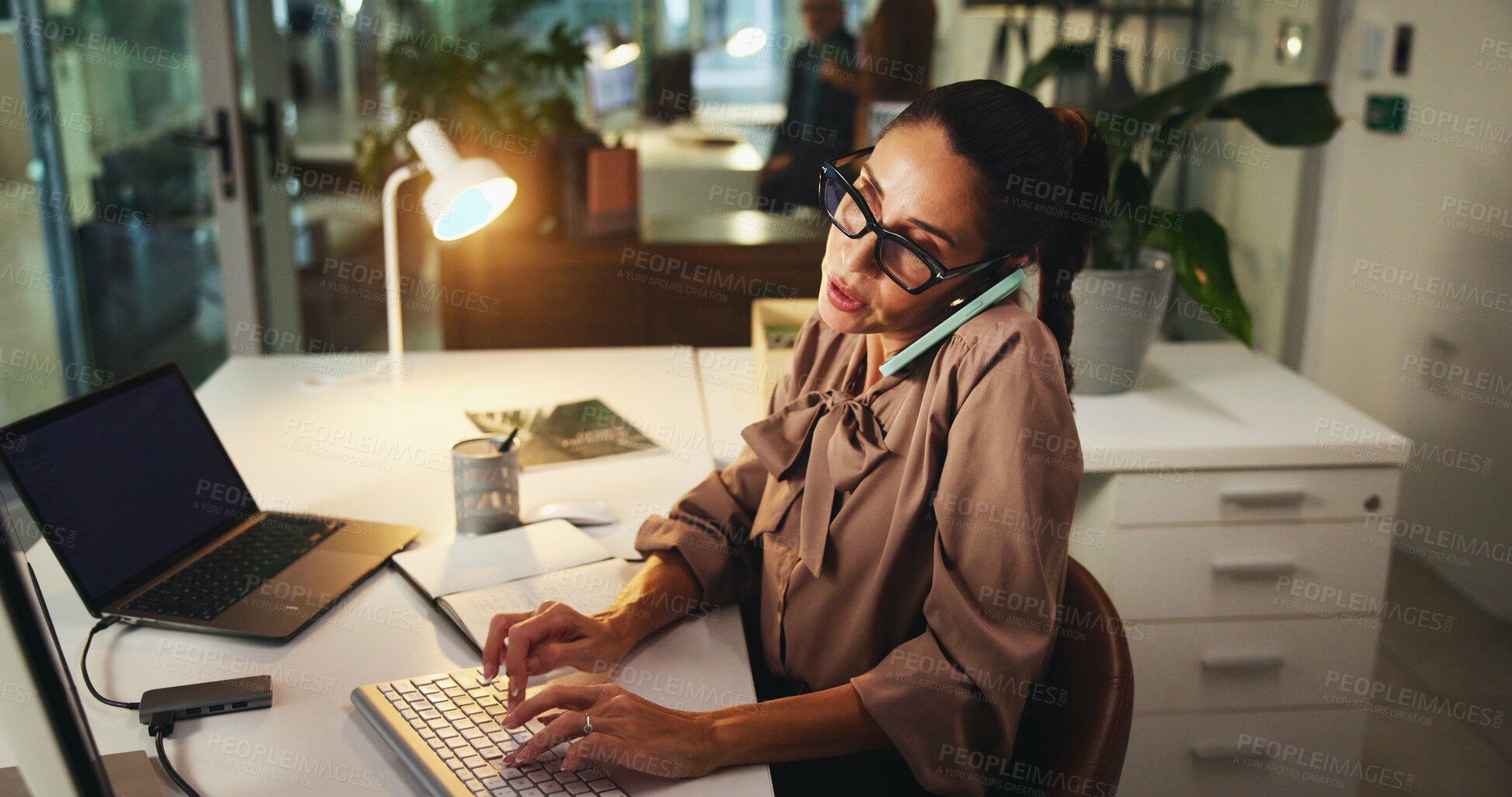 Buy stock photo Woman, phone call and typing feedback in office, research computer and plan for sustainable funding. Online, networking and communication for account update, review budget and chat with investor