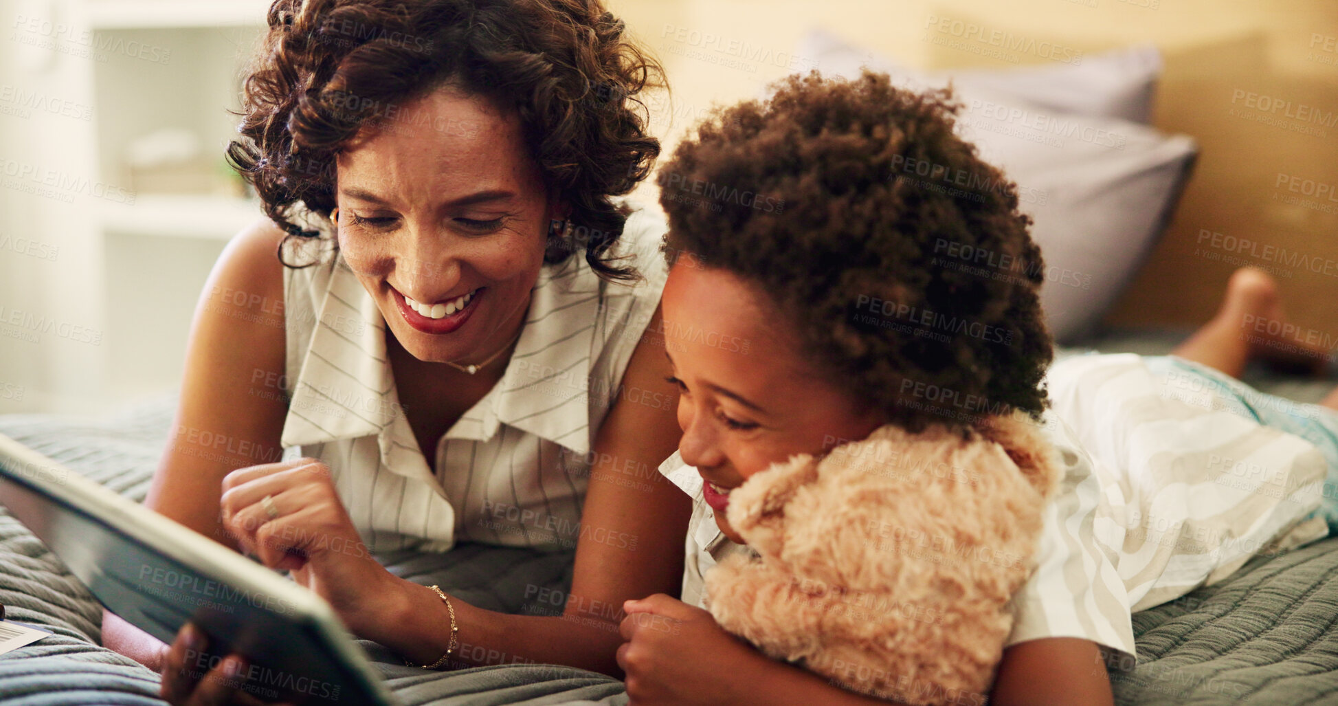 Buy stock photo Woman, kid and relax on bed with tablet, streaming media or show educational video in home. Mother, child or tech in bedroom for bonding, interactive learning app or browse toy website for teddy bear