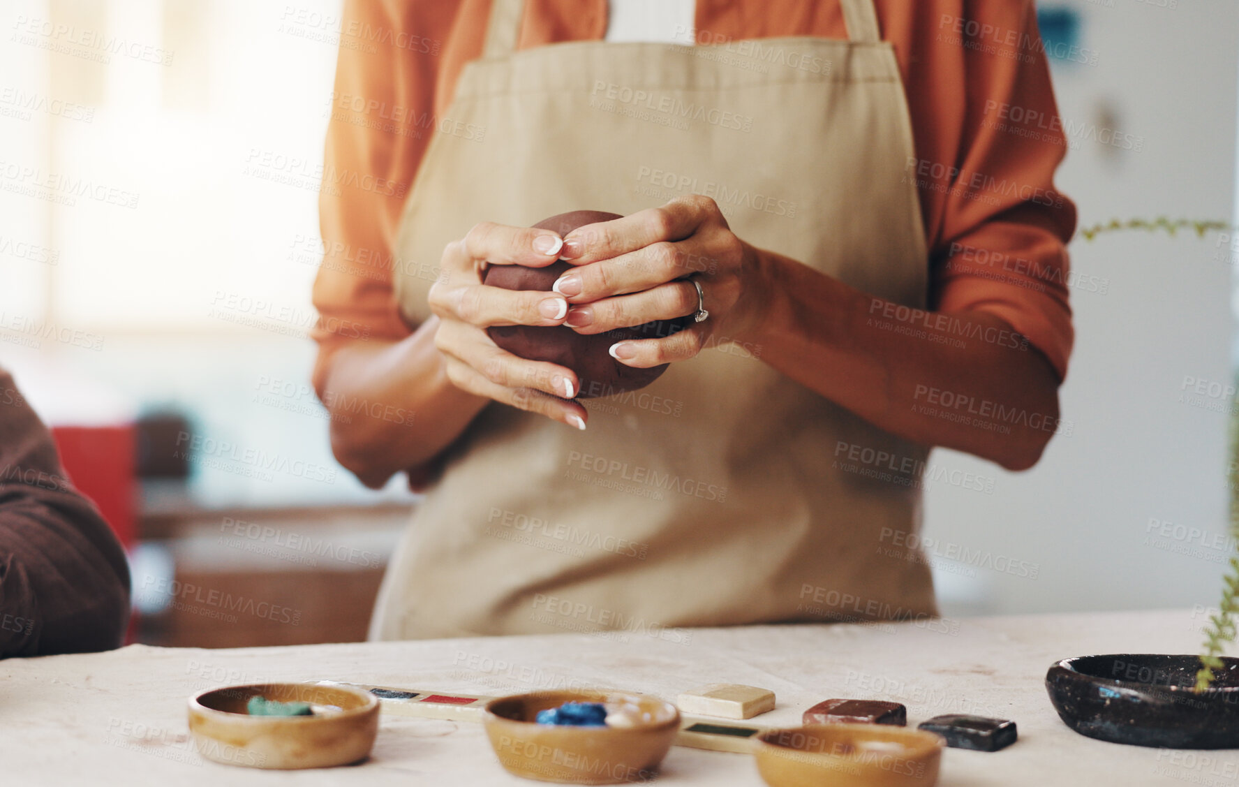 Buy stock photo Hands, pottery and woman with clay in workshop for artistic process, design or production. Creative, sculpting and female person working on ceramic piece for startup business with manufacturing mud.