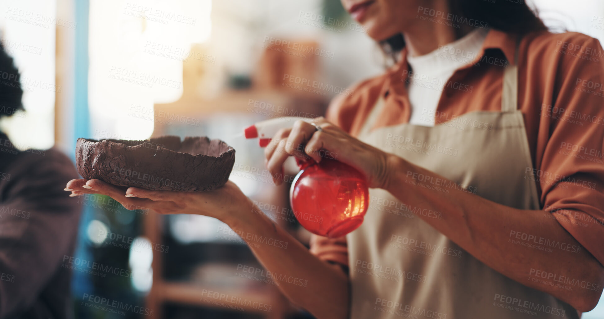 Buy stock photo Hands, water and woman with clay in workshop for artistic process, design or production. Creative, sculpting and female person working on ceramic piece for startup business with manufacturing pottery