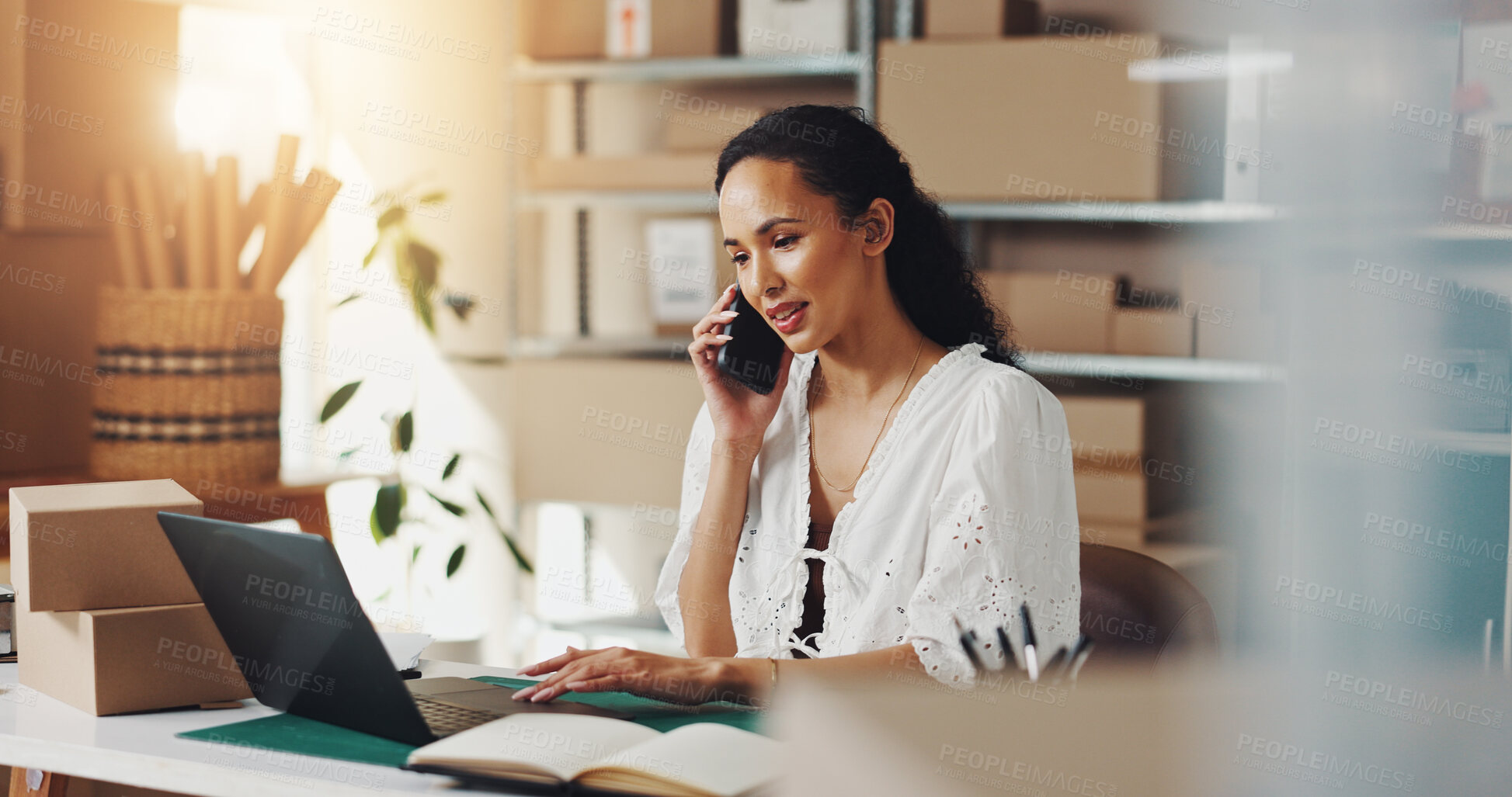 Buy stock photo Owner, boxes and woman with phone call on laptop for stock order, supply chain and shipping checklist. Small business, ecommerce and person with discussion for client package, online shop and flare