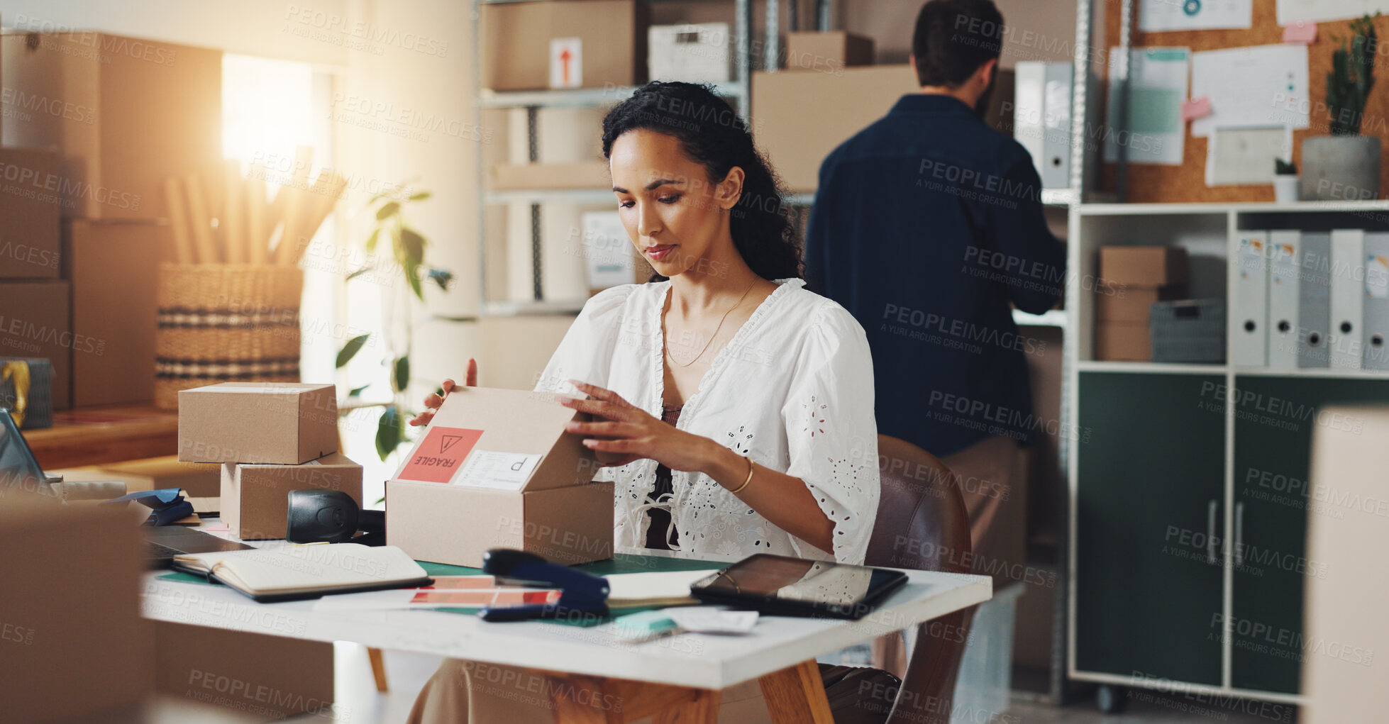 Buy stock photo Woman, courier box and delivery in office, open package and commercial supply chain at desk, Professional, female person and business mail for cardboard distribution, logistics and import goods