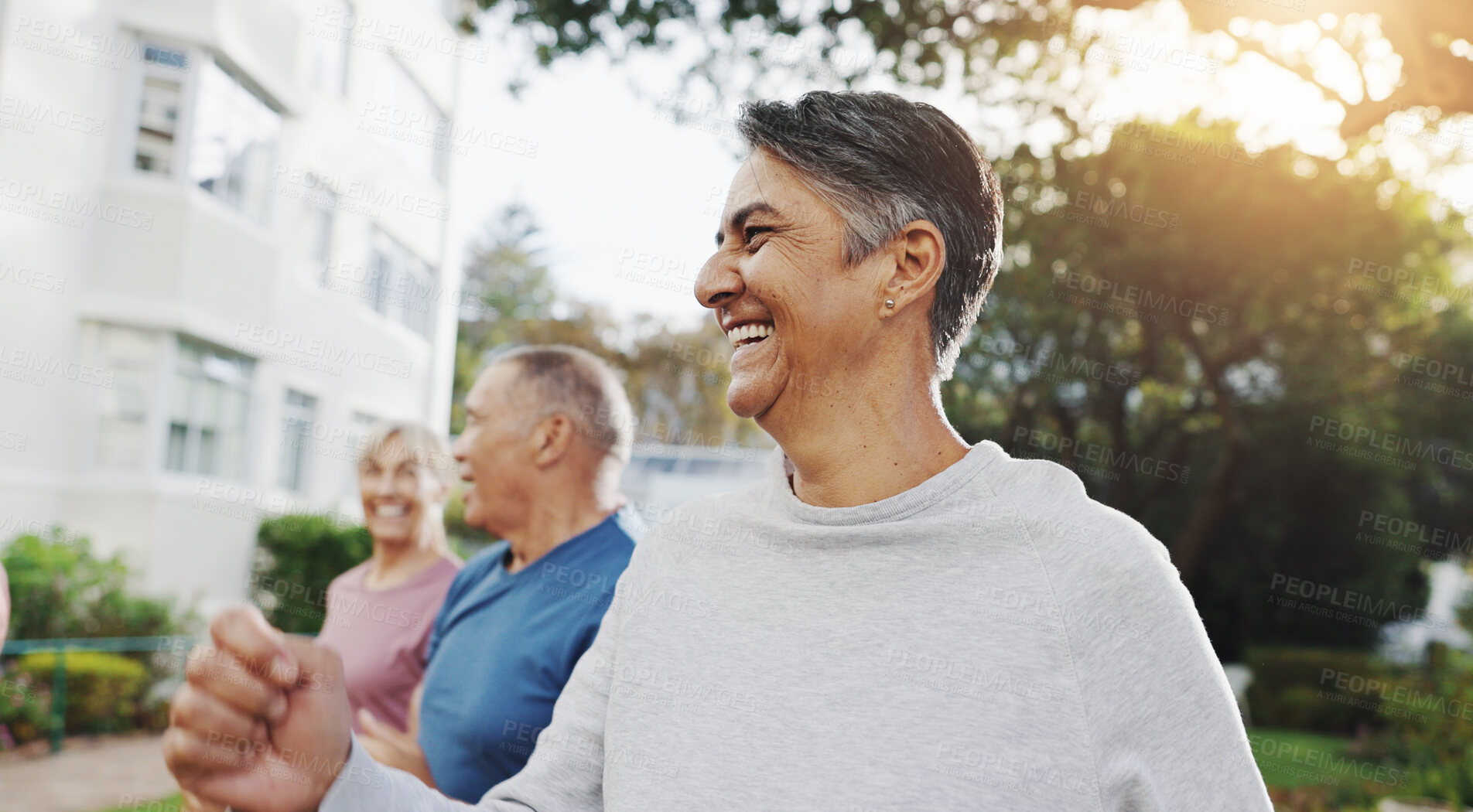 Buy stock photo Senior man, exercise and group in garden at retirement village, health and fitness class in morning. People, happy and workout with diversity, excited and ready for training in summer for wellness
