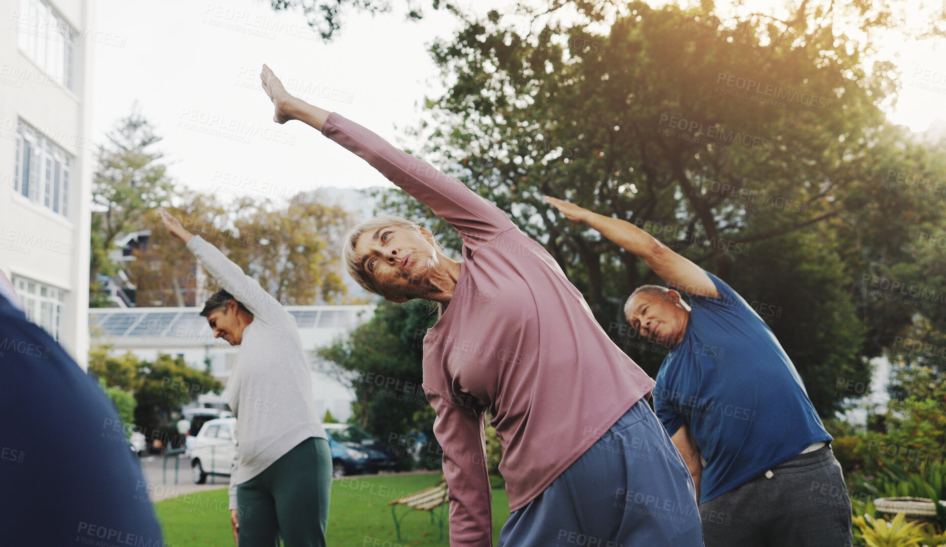 Buy stock photo Fitness, elderly people and outdoor with stretching for yoga, exercise class or wellness in retirement. Senior group, pilates session or warm up in garden for balance, breathing control or community
