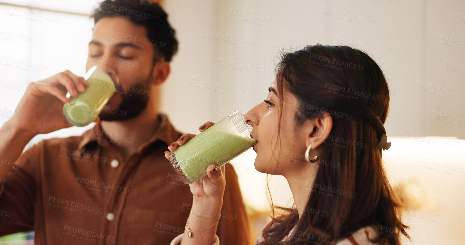 Buy stock photo Nutrition, couple and drinking green smoothie in home for digestive health, detox shake and breakfast drink. People, wellness and organic beverage for weight loss, immunity and natural antioxidants