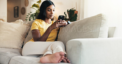 Buy stock photo Relax, phone and chat with woman on sofa for social media post, streaming and network platform. Reading, notification and mobile app with person in living room of home for comment and story update