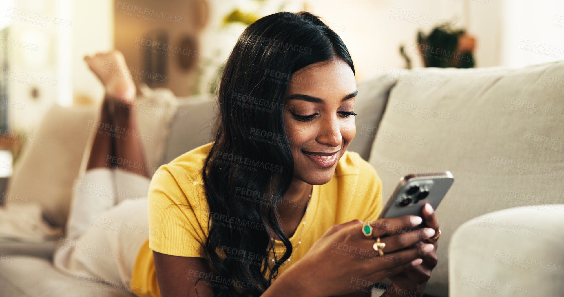 Buy stock photo Relax, online and woman with smartphone, home and smile for romance ebook, browsing and comfortable. Lounge, resting and entertainment for person with mobile, website and reading of novel in house