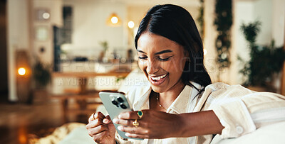 Buy stock photo Woman, phone and laughing with texting on sofa in home, chat and funny meme in living room. Girl, person and smile with mobile app, contact and comic video on social media in lounge at apartment