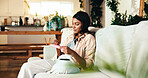 Woman, living room and self care with nail file for manicure, smooth edges and shape tool. Home, lounge and person relax on sofa with hygiene, wellness and aesthetic grooming with cosmetic process