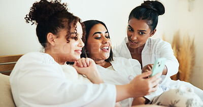 Buy stock photo Girl, friends and phone in bedroom at spa with sharing, talk and relax with memory on vacation together. Women, group and happy with smartphone, mobile app and social media for bonding at resort