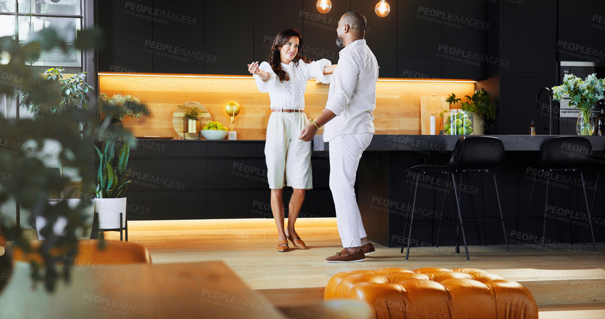 Buy stock photo Love, hug and support with interracial couple in kitchen for bonding, connection and romance. Happiness, embrace and care with man and woman at home for commitment, marriage and valentines day