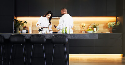 Buy stock photo Love, talking and coffee with interracial couple in kitchen for bonding, morning and romance. Happiness, support and care with man and woman at home for caffeine, marriage and valentines day