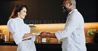 Buy stock photo Love, dance and trust with interracial couple in kitchen for bonding, connection and romance. Happiness, support and care with mature man and woman at home for commitment, marriage and valentines day