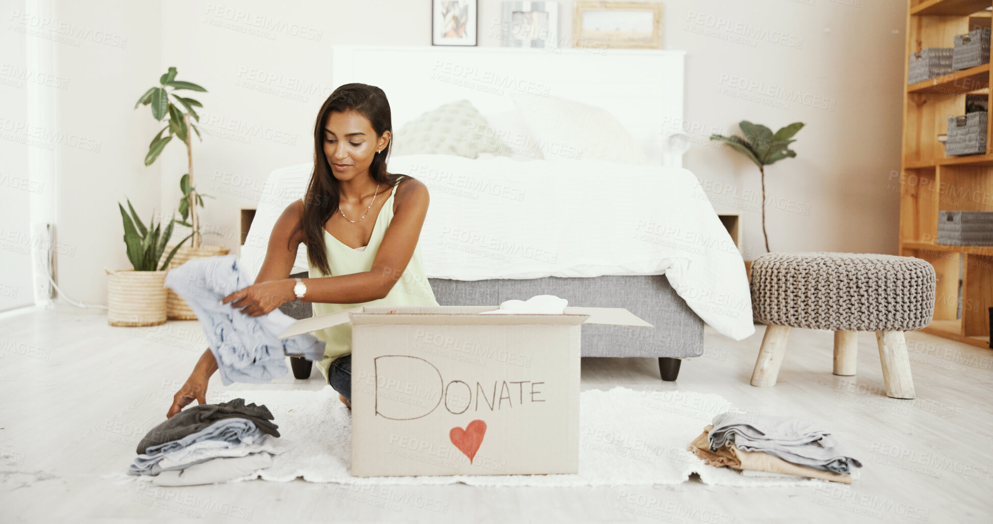 Buy stock photo Woman, home or box to donate clothes for charity, nonprofit or community service for support. Indian girl, hope or packing to help for social responsibility, assistance or volunteering to give away