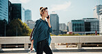 City, walking and woman with phone call for travel, commute or real estate agent with negotiation. Urban, business person and realtor with mobile for talking, journey or contact for property question