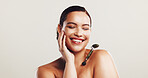 Smile, woman and roller for skincare in studio for facial massage, blood circulation and treatment. Person, tools and beauty with dermatology benefits, lymphatic drainage and glow on white background