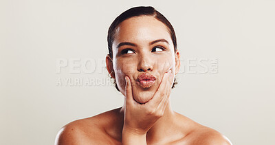 Buy stock photo Woman, thinking and pout for skincare in studio for natural beauty, facial treatment and dermatology glow. Female person, kiss and cosmetics for self care, shine results and space on white background