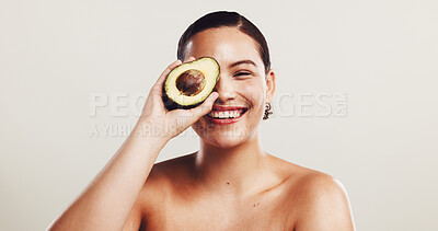 Buy stock photo Avocado, skincare and portrait of woman in studio with natural, organic and moisturizing face routine. Beauty, dermatology and female person with fruit for facial elasticity by white background.