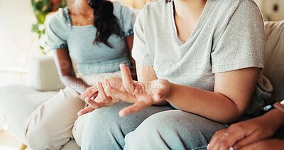 Buy stock photo Women, hands or talking with friends on sofa for care, support group or intervention at home. Closeup, female people or listening with discussion on couch for confession, empathy or sympathy at house