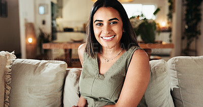 Buy stock photo Portrait, smile and woman on sofa for relax, peace and calm on weekend for comfort. Face, living room and female person in home  for chill, resting and happy student on break on womens day in UAE