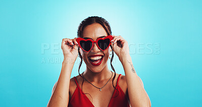 Buy stock photo Fashion, laughing and woman with sunglasses, studio and excited for discount for product or mockup space. Blue background, trendy and person with sale for shades, Gen z and deal for happy customer