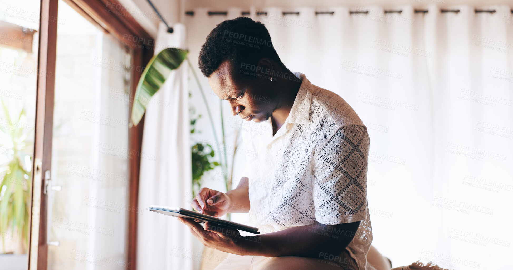 Buy stock photo House, typing and black man with tablet, online reading and network for communication. African person, apartment and guy with tech, connection and digital app for social media and email notifications