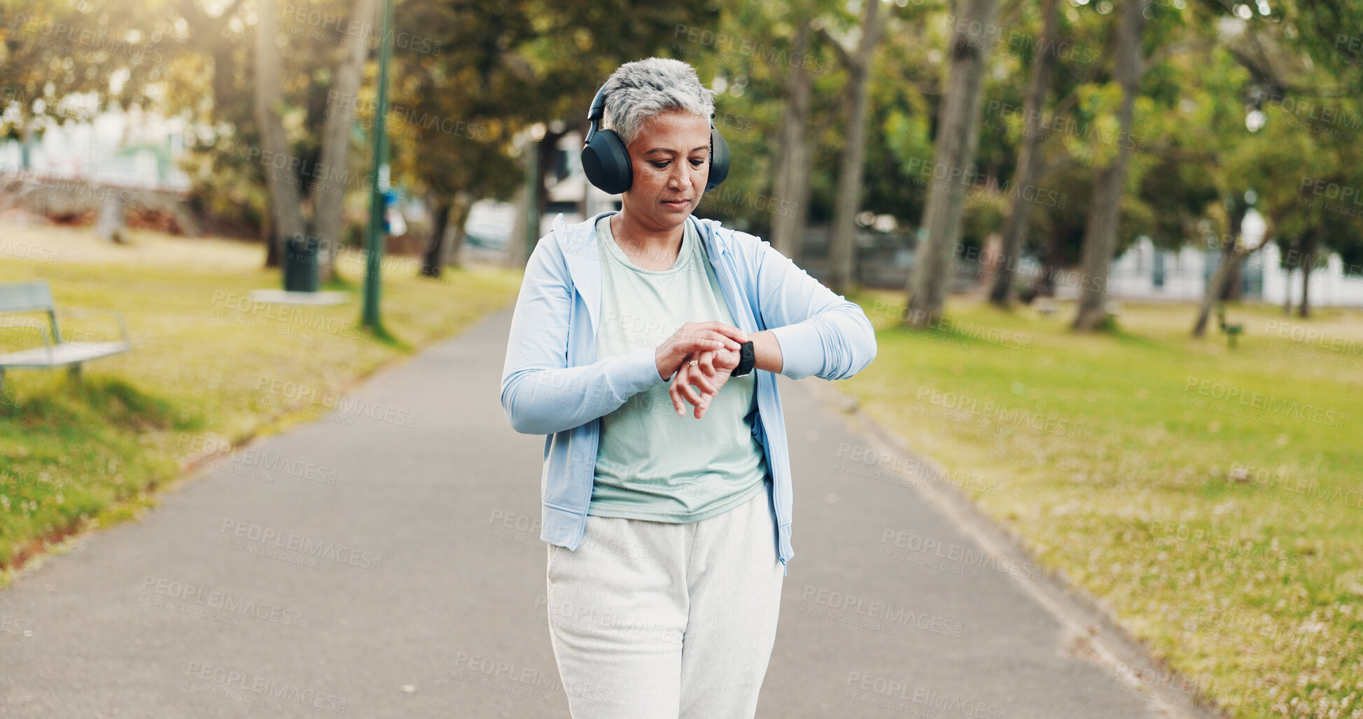 Buy stock photo Park, senior woman and smart watch for fitness, exercise steps or tracking performance. Outdoor, wristwatch or sports athlete checking workout results, timer and body health with headphones for music