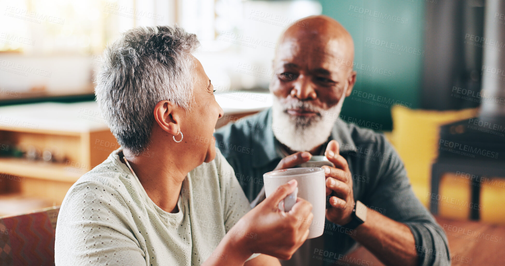 Buy stock photo House, coffee and old couple with love, cheers and bonding together with relationship. Conversation, senior man and mature woman in living room, cappuccino and herbal tea with marriage and discussion