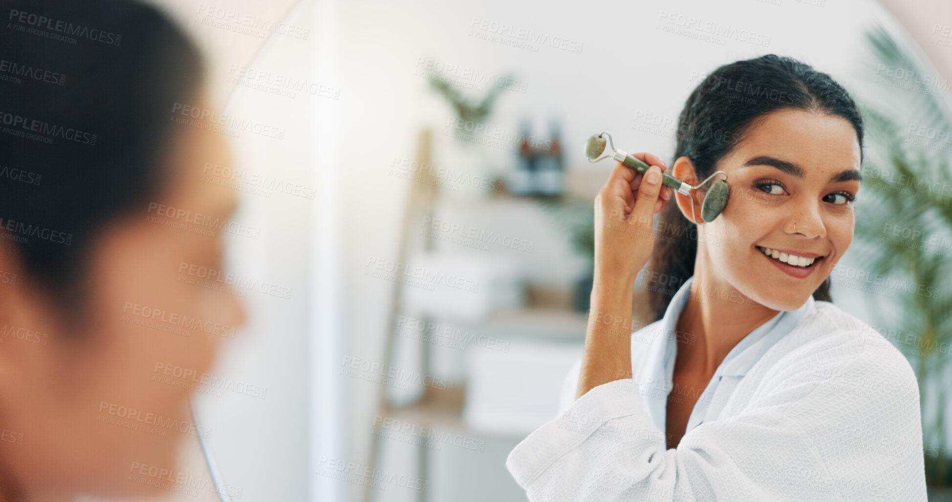 Buy stock photo Mirror, happy woman and jade roller for skincare, beauty or morning routine in home bathroom. Face, stone and reflection for facial cosmetic massage, treatment and lymphatic drainage for dermatology