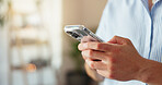 Home, person and hands with smartphone for chat, online communication and connection with contact. Technology, man and cellphone for mobile application, social media and message by closeup in house