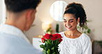 Roses, gift or couple in home for valentines day with love, support or smile for gratitude. Giving, celebrate or people with bouquet of flowers, romance or present for anniversary or bonding together