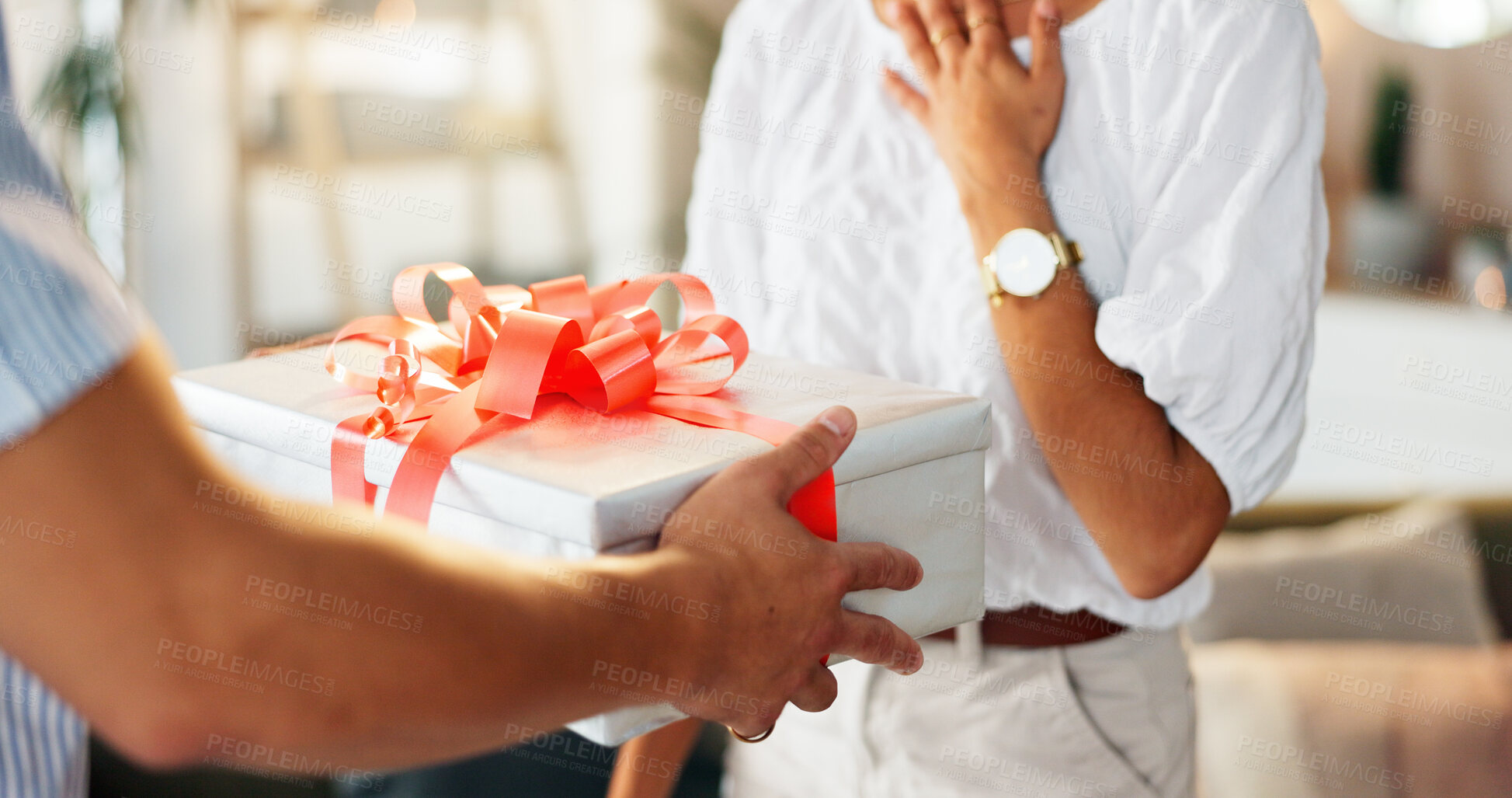 Buy stock photo Couple, hands and box with ribbon on gift for surprise, present or valentines day at home. Closeup, people or offering lover with parcel, special delivery or package for anniversary or birthday