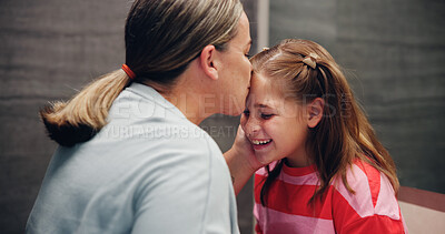 Buy stock photo Mother, child and kiss on forehead in home for love, support and daughter bonding together with parent. Mom, girl and affection with kid for care, connection and happiness with family for motherhood