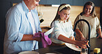 Father, daughter and cleaning dishes in home with plate disinfection, dirt removal or learning responsibility. Proud mother, teenage girl and help man with kitchen chores, bonding together or hygiene