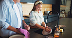 Parent, child and washing plates in kitchen with household chores, learning responsibility or bonding together. People, teenage daughter or cleaning teamwork for dirt removal, support or help in home