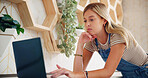 Woman, florist and typing with laptop for inventory, online order or checking stock at floral store or shop. Female person, environmentalist or flower dealer with computer for research or design