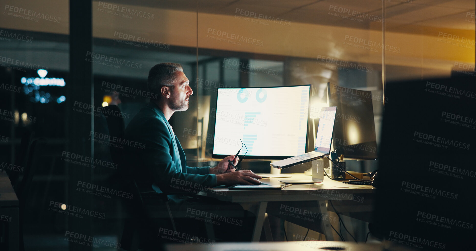 Buy stock photo Office, night and businessman on computer with finance statistics for budget, research and analytics. Corporate, company and person working late for financial planning, review and fintech report