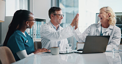 Buy stock photo Hospital, happy and doctors high five in meeting for consulting, teamwork and medical support. Healthcare, celebration and man with women on computer for collaboration, research or telehealth success