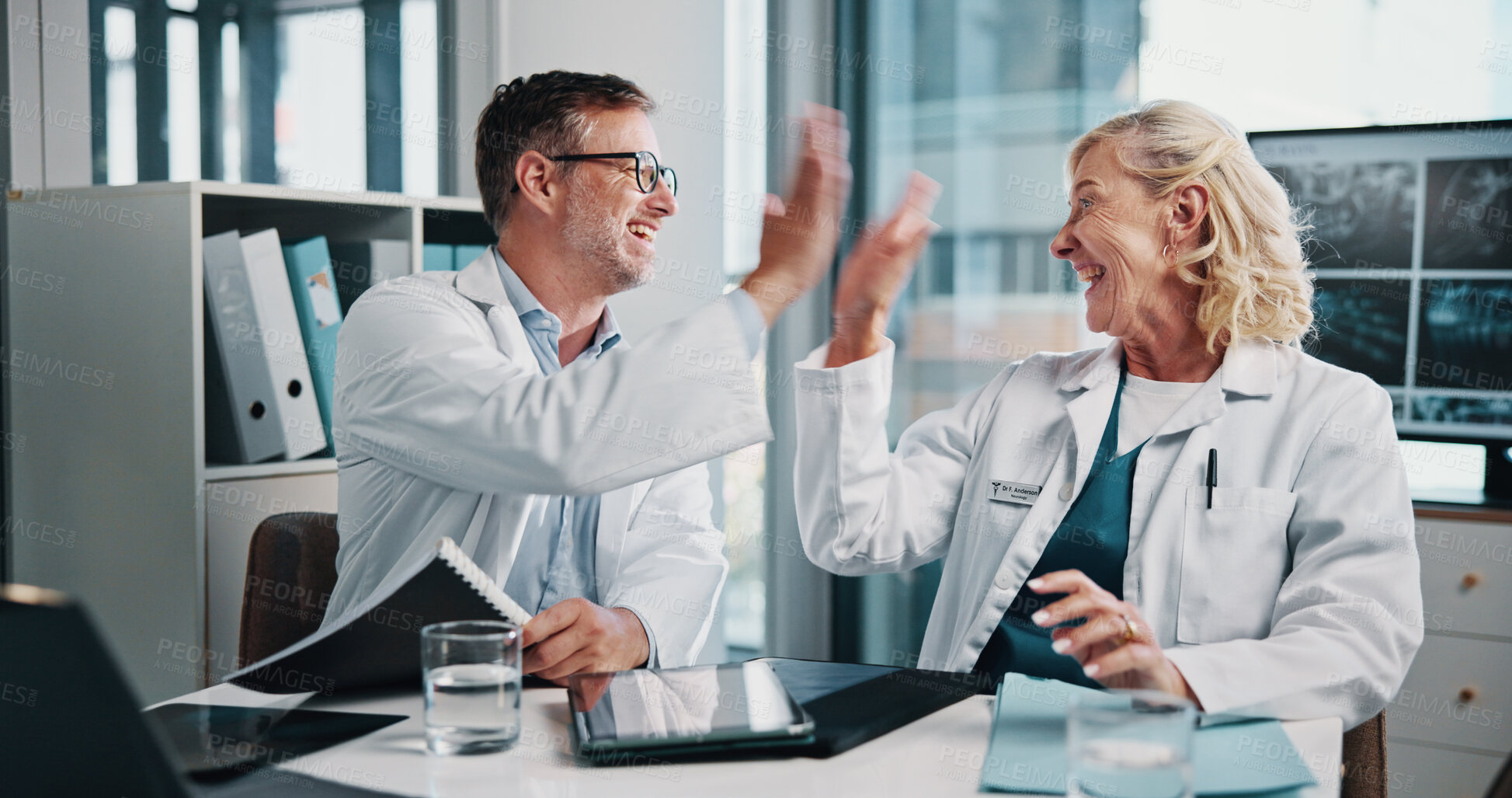 Buy stock photo People, doctors and meeting with high five at hospital for study success, lab results and celebration. Happy, staff and collaboration with radiology achievement, medical report and treatment solution