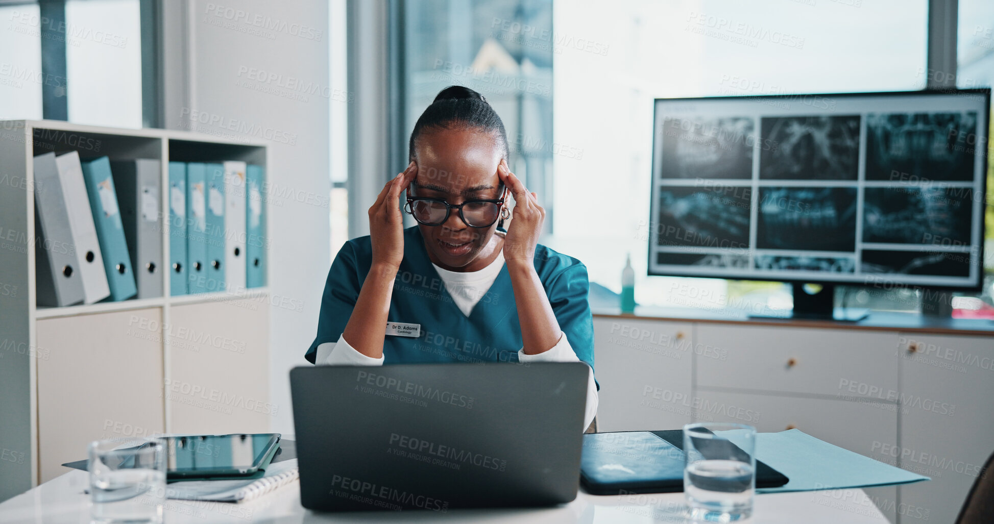 Buy stock photo Headache, black woman and doctor with laptop for xrays in hospital for stress, burnout or mistake. Migraine, computer and African healthcare worker with fatigue for medical emergency plan in clinic.