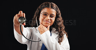 Buy stock photo Portrait, child and doctor with stethoscope in studio for cardiology, heartbeat and listen to rhythm. Smile, kid and medical tools with career fantasy, lungs sound and opportunity on black background