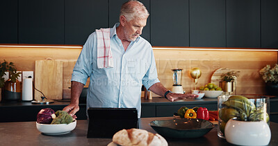 Buy stock photo Mature man, tablet and cooking with recipe tutorial, dinner method or online guide in home. Learning, instructions and senior person in kitchen with healthy ingredients, diet or steps in meal prep