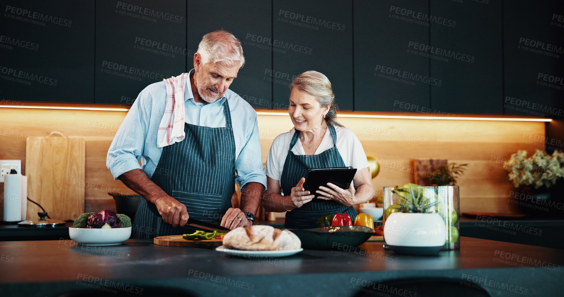 Buy stock photo Cooking, chopping and mature couple with tablet, vegetables or bonding with ingredients for cuisine in home. Healthy food, help and people with research of recipe, kitchen or culinary skills in house