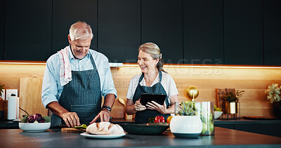 Buy stock photo Cooking, mature couple and smile for meal prep, kitchen and bonding with ingredients for cuisine in home. Healthy food, helping and people with tablet for research of recipe, culinary skills or house